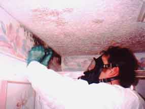 This is a Certified Mold Inspector taking a sample of mold growing in a bathroom.